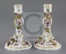 A pair of Chelsea gold anchor period candlesticks, c.1760, each moulded and highlighted in gilt with