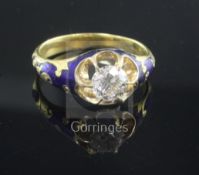 A late Victorian gold, blue enamel and claw set solitaire diamond ring, size P.