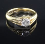 A 1930's 18ct gold and claw set solitaire diamond ring, size U.