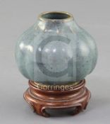 A Chinese Jun-type lobed ovoid vase, 17th/18th century, covered in a greenish lavender glaze,