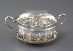 A George V silver two handled porringer and cover/stand, by Horace Woodward & Co Ltd, with