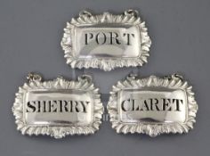 A set of three George III silver wine labels by George & John Cowie, Claret, Port & Sherry, of