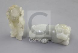 Two Chinese pale celadon jade figures of Liu Hai and his three legged toad and a recumbent lion-dog,