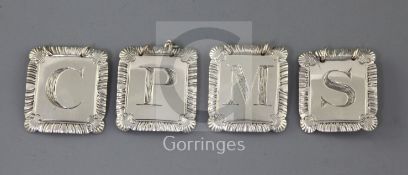 A set of four George III silver wine labels by John Reily, each with an engraved initial and