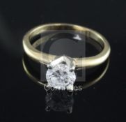 A 14ct gold and solitaire diamond ring, the round brilliant cut stone measuring 6.1mm in diameter,
