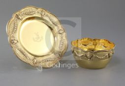A George V silver gilt bowl and stand, Charles Stuart Harris & Sons, with fluted swag and urn