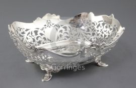 A George V pierced silver oval fruit bowl by Atkins Brothers, with scroll decoration on four