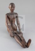 A late 19th / early 20th century carved wood artist's lay figure, 19.25in.