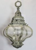 A late 19th century silvered bronze hexagonal hall lantern, cast and pierced with foliate motifs and