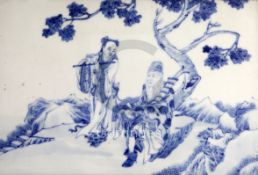 A Chinese blue and white plaque, 20th century, painted with two immortals beneath a tree, the plaque
