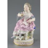 A Meissen figure of a girl seated on a chair, late 19th century, after Acier, holding a watch in her