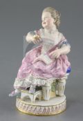 A Meissen figure of a girl seated on a chair, late 19th century, after Acier, holding a watch in her