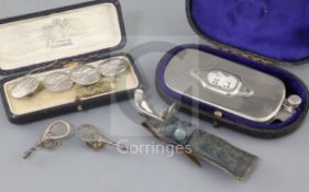 An early 20th century novelty five piece sterling silver manicure set modelled as gold clubs in a