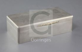 A 1930's engine turned silver rectangular cigarette box by Padgett & Braham Ltd, with gold