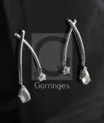 A pair of white gold? and diamond double drop earrings, each of wishbone shape and set with one