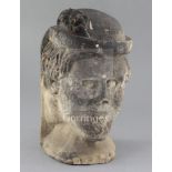 A medieval or later limestone head, height 14in.