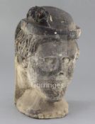 A medieval or later limestone head, height 14in.