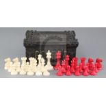 A Jaques of London Staunton carved and stained ivory chess set, with original papier mache box and