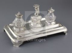 A Victorian silver inkstand by Henry Holland, of rounded rectangular form, with two mounted glass