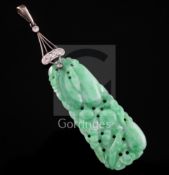A Chinese jadeite and diamond mounted pendant, the apple green and ice white jadeite plaque carved