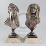 A pair of Austrian terracotta cold painted busts of Moors, 8.5in., on ebonised wooden socles with