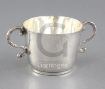 A James II silver porringer, with scrolling handles and engraved initials, maker's mark 'D'