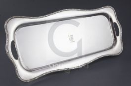 An Edwardian silver rectangular tray by Martin, Hall & Co, with inset handles and engraved