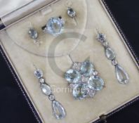 A cased early to mid 20th century 9ct white gold, aquamarine and diamond set demi-parure, comprising