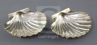 A pair of 1960's parcel gilt silver butter shell dishes, by William Comyns & Sons Ltd, with conch