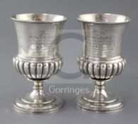 A pair of George III Scottish demi fluted silver goblets, by George McHattie, both with later