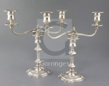 A pair of late 1960's silver two branch, two light candelabra by James Dixon & Sons, with reeded