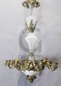 A 19th century French gilt metal and opaque glass twelve light chandelier, decorated with vineous