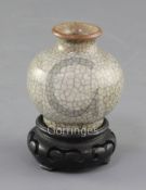 A small Chinese crackle-glaze globular vase, 18th/19th century, height 5.8cm, wood stand