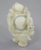 A Chinese pale celadon jade group of a sage with a boy on his back, 18th/19th century, the bearded