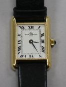 A lady's 18ct gold Baume & Mercier rectangular dial manual wind wrist watch.