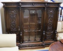 A large 19th century French carved walnut breakfront bookcase by Bellanger, Meubles d'Art, W.200cm