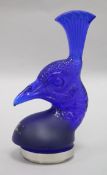 A Lalique cobalt blue glass 'Tete de Paon' car mascot, modelled as a Peacock's head, on circular