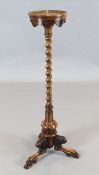 A Victorian carved walnut torchere W.40cm. (at base)