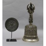 A Tibeto-Chinese ghanta bell and a Tang-style mirror