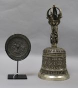 A Tibeto-Chinese ghanta bell and a Tang-style mirror