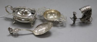 A silver mustard pot, a late 19th century continental spoon, a sterling silver model of a rickshaw