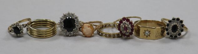 Eight assorted 9ct gold and gem set dress rings.