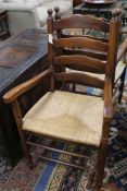 A set of eight ladderback rush seat oak dining chairs