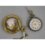 A modern Russian gilt metal and enamel pocket watch and an earlier silver fob watch.