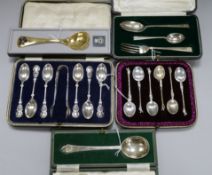 A Georg Jensen silver gilt and enamel spoon for 1977 and sundry silver cased flatware, including a