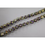 A gilded and cloisonne sphere necklace, approx. 90cm.