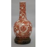 A late/early 19th century Chinese coral red phoenix vase height 29cm incl. carved stand