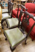 A set of four 1920's Chippendale style mahogany dining chairs