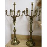 A pair of Victorian brass seven-light candlesticks, with detachable candle arms, H 82cm