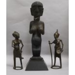 Two African bronze stylised female figures and a carved wood female fertility figure standing on